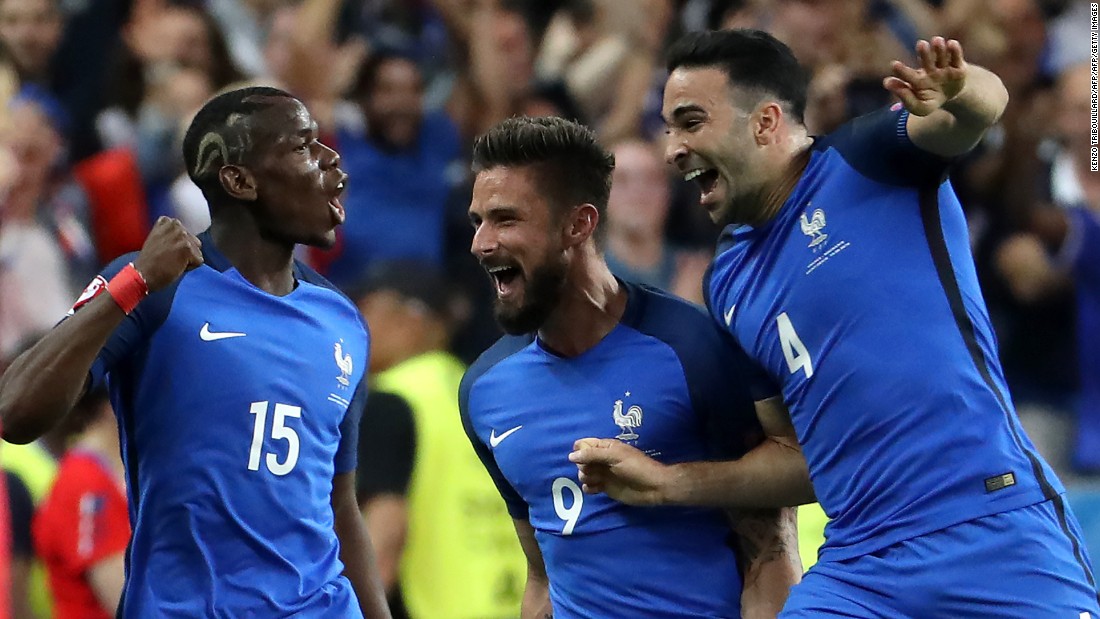 From left, French players Paul Pogba, Olivier Giroud and Adil Rami celebrate Giroud&#39;s opening goal in the 57th minute.
