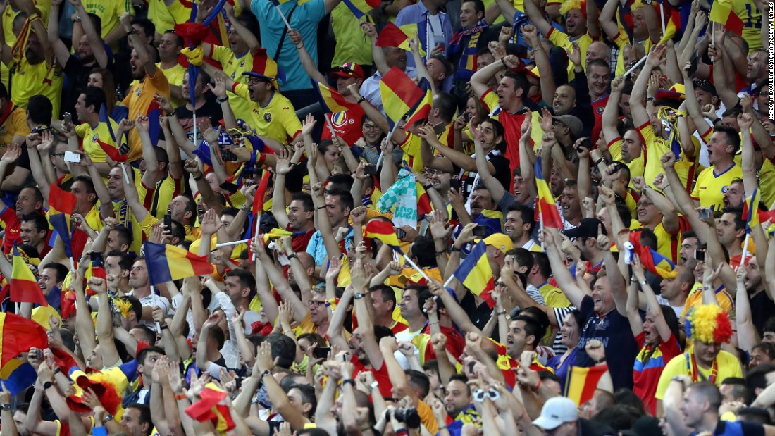 Romania&#39;s fans rejoice in the stands after Stancu&#39;s penalty.