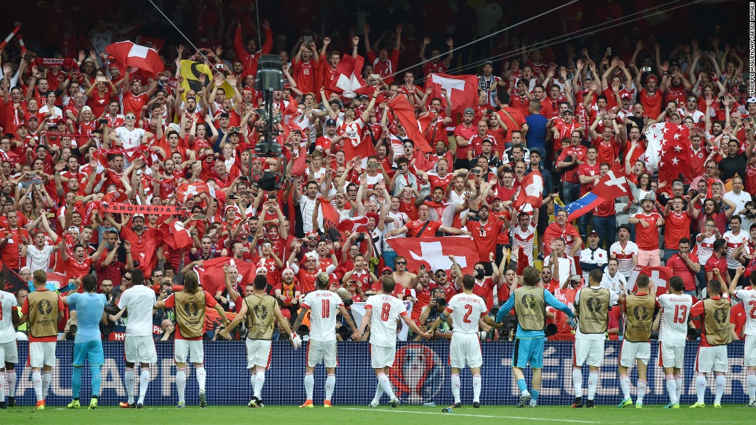 Switzerland&#39;s players celebrate their 1-0 victory over Albania with their supporters at the Bollaert-Delelis Stadium in Lens, France, on Saturday, June 11.