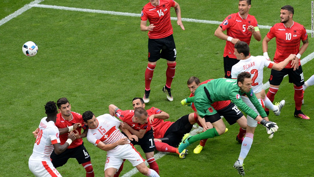 Switzerland&#39;s defender Fabian Schaer, second right,  heads the ball to score.