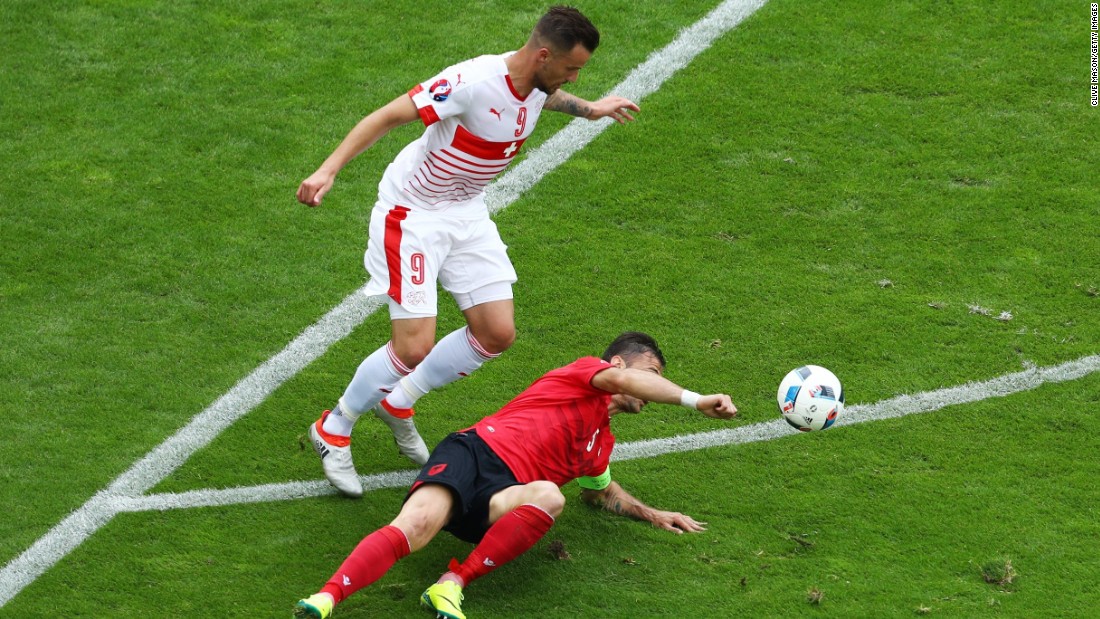 Lorik Cana of Albania touches the ball with his hand resulting in the second yellow card .Cana was later ejected from the game. 