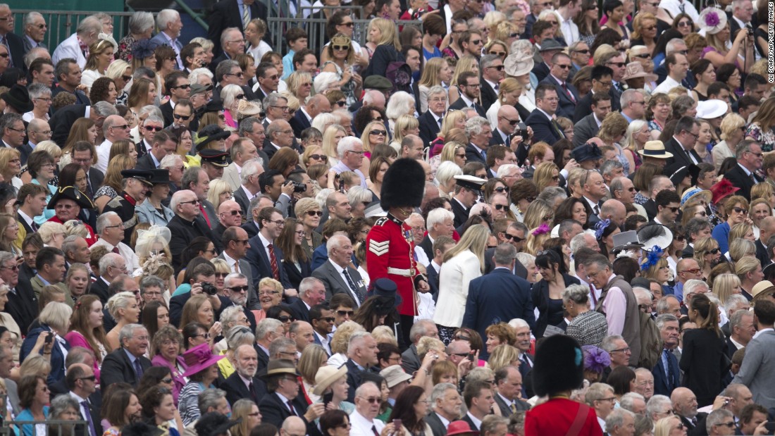 Soldiers direct guests to their seats to watch the traditional &lt;a href=&quot;http://edition.cnn.com/2016/06/11/europe/queen-elizabeth-birthday-britain/index.html&quot;&gt;Trooping the Color&lt;/a&gt; in London on Saturday, June 11. The Queen continues to celebrate her 90th birthday with the display of more than 1,400 officers and men in their famous red jackets and black bearskin hats, with 200 horses and more than 400 musicians.
