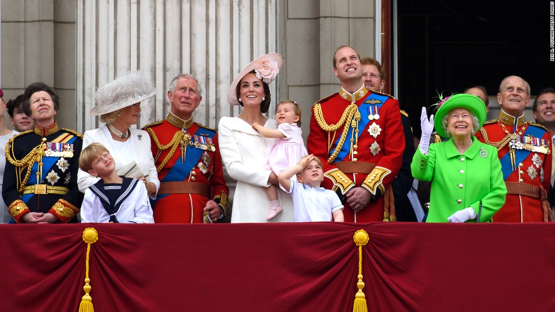 From left to right:  Anne, Princess Royal; Camilla, Duchess of Cornwall; Charles, Prince of Wales; Catherine, Duchess of Cambridge, Princess Charlotte of Cambridge; Prince George of Cambridge; Prince William, Duke of Cambridge; Prince Harry, Queen Elizabeth II and Prince Philip, Duke of Edinburgh, gather on a balcony to watch the events. 