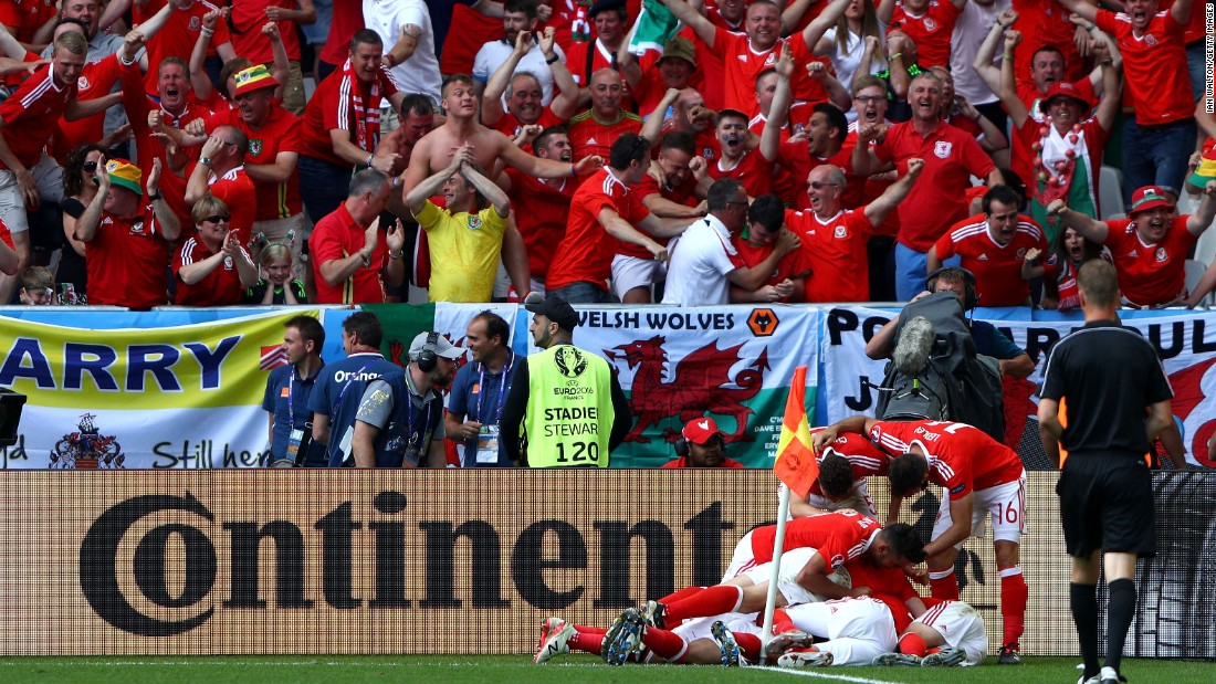 Wales players celebrate their team&#39;s second goal scored by Hal Robson-Kanu.  It has been 58 years since Wales last played in a major tournament.