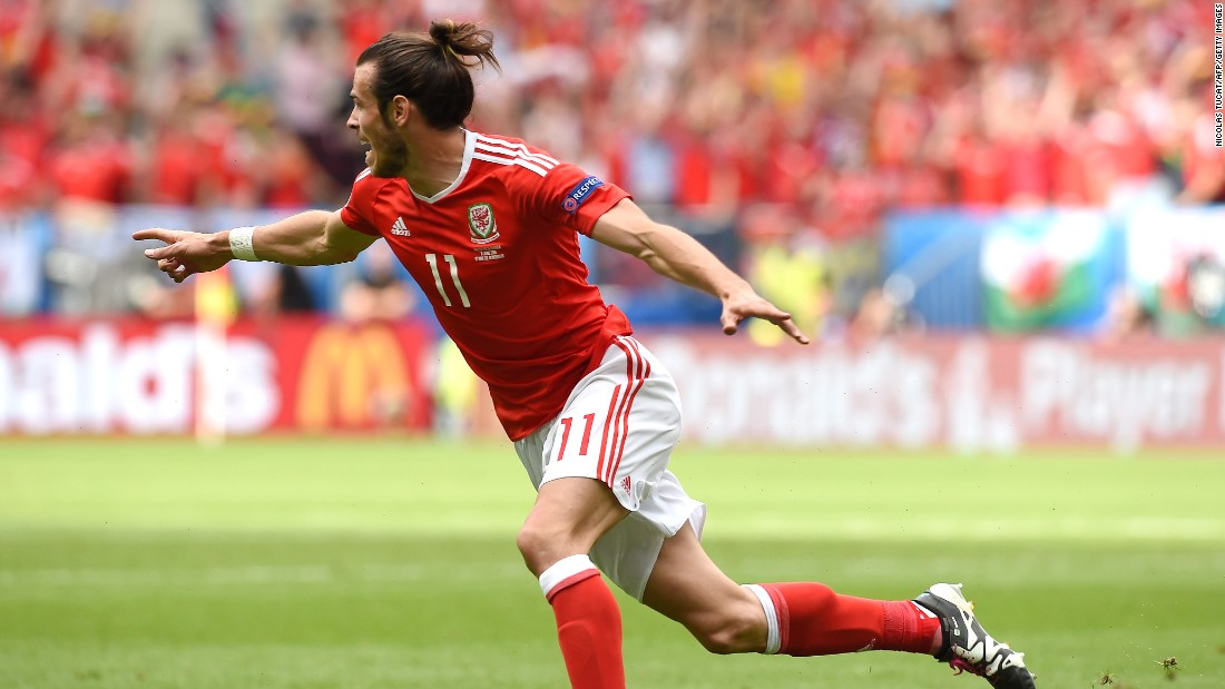 Wales forward Gareth Bale celebrates after scoring the match&#39;s first goal.
