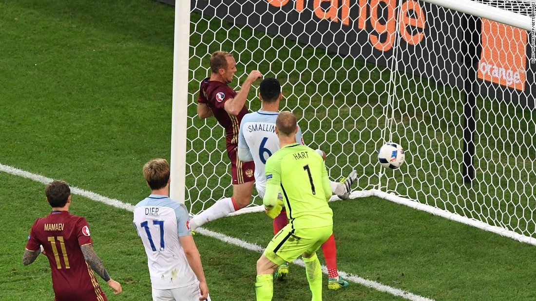 England&#39;s goalkeeper Joe Hart, center, looks at the ball going into his net as Russia scores at the end of the game.  Russia&#39;s &lt;a href=&quot;http://www.cnn.com/2016/06/11/football/england-russia-euro-2016/index.html&quot;&gt;92nd minute equalizer&lt;/a&gt; denied England victory.