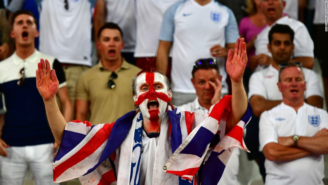 An England supporter cheers on his team. 