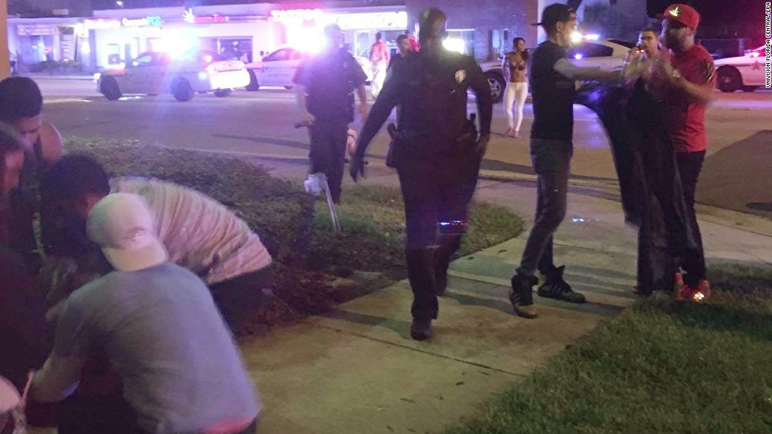 Police officers respond to the scene of the shooting. 