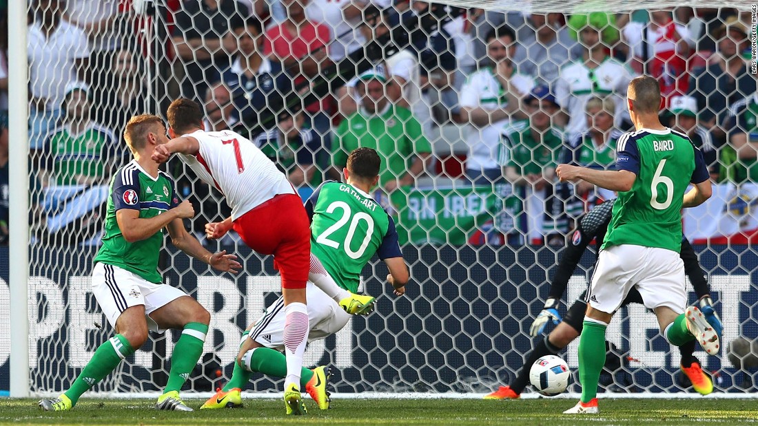 Poland&#39;s Arkadiusz Milik, second from left, scores a goal against Northern Ireland during their Euro 2016 opener in Nice, France. Poland won 1-0.
