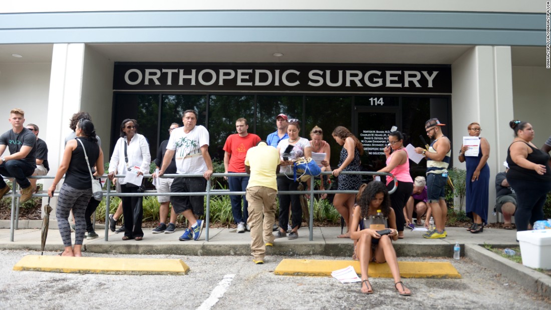 People line up to donate blood at a blood bank in Orlando.