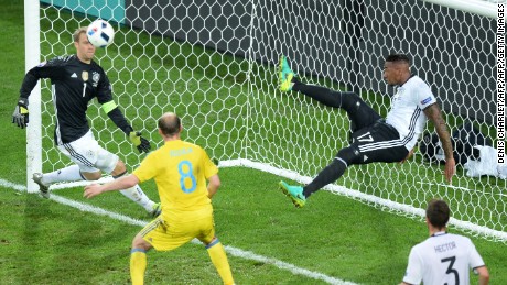 Germany&#39;s defender Jerome Boateng clears the ball from his goal.