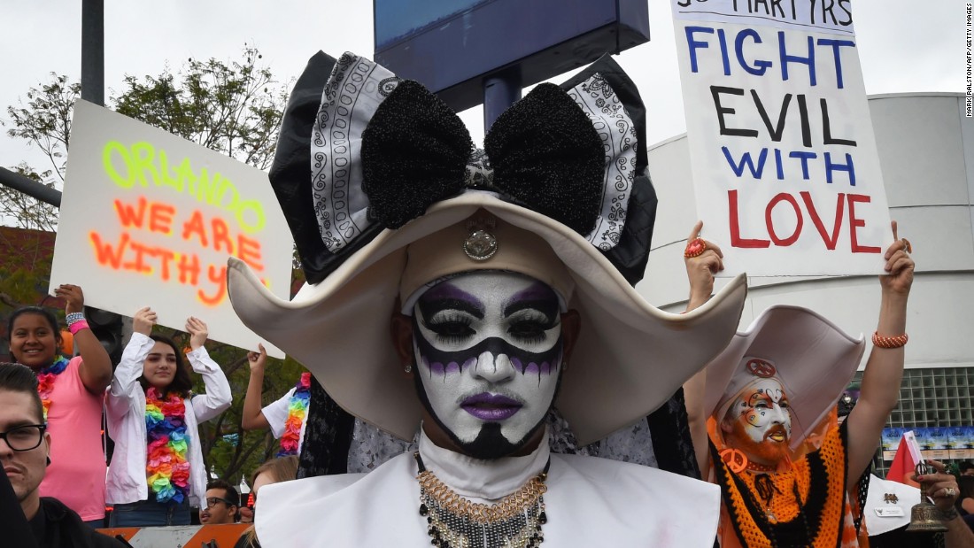 Participants in the Los Angeles gay pride parade show their support for the victims on June 12.