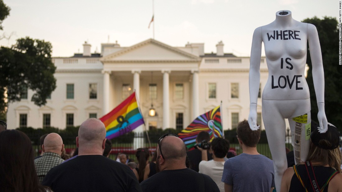 Mourners gather during a vigil in front of the White House on June 12. President Barack Obama called the mass shooting an &quot;act of terror&quot; in remarks to the nation.