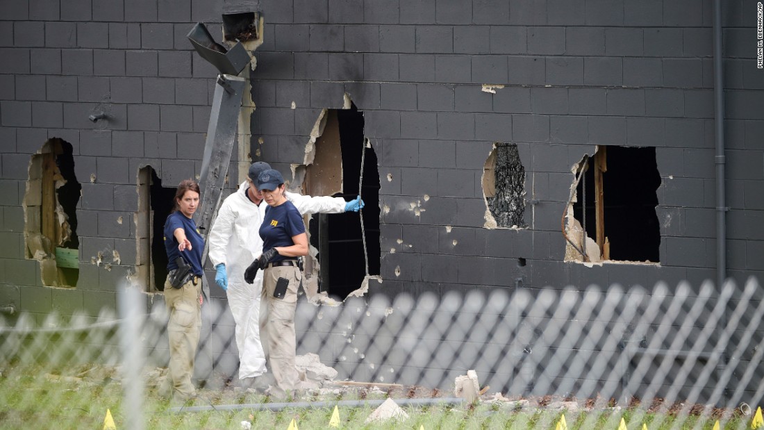 Police investigate the back of the Pulse nightclub in Orlando on Sunday, June 12. At least 49 people were killed there by Omar Mateen, who was shot and killed by Orlando police. It was the deadliest mass shooting in U.S. history.