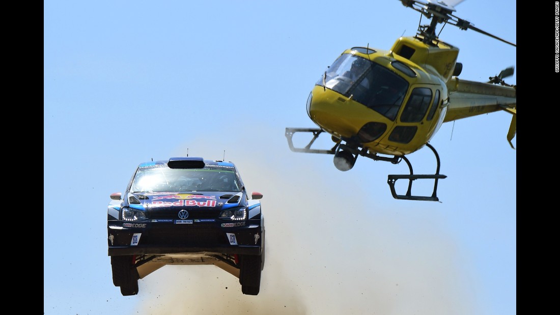 The rally car of Jari-Matti Latvala and Miikka Anttila catches air during a race in Italy on Saturday, June 11.