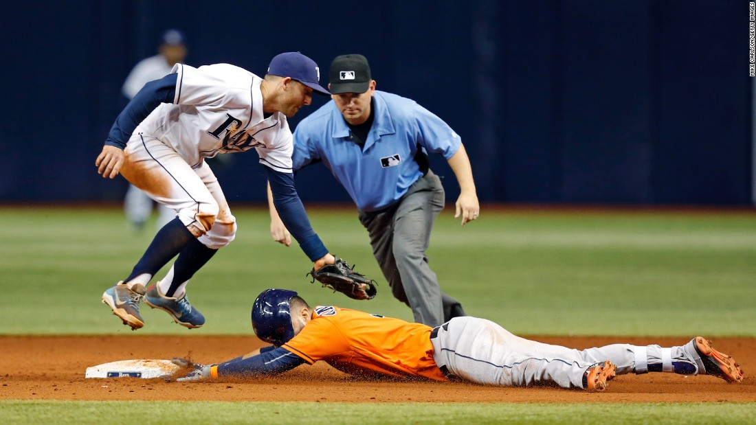 Houston&#39;s Marwin Gonzalez slides under the tag of Tampa Bay&#39;s Brad Miller after hitting a double on Friday, June 10.