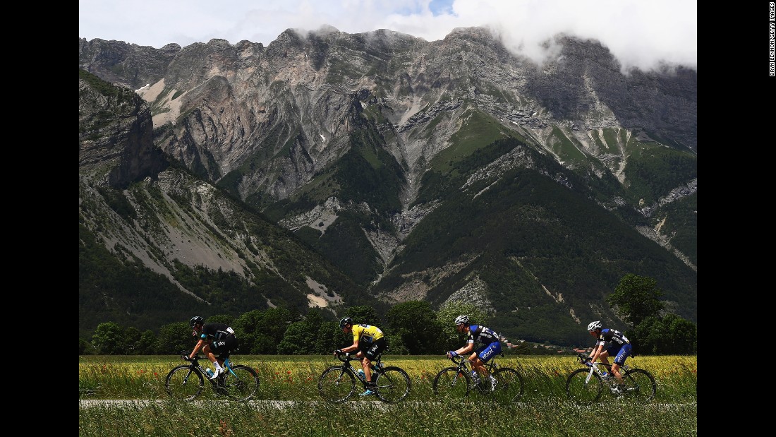 Chris Froome, in the yellow jersey, rides with teammates in Superdevoluy, France, during the last stage of the Criterium du Dauphone on Sunday, June 12. Froome won the road race for the third time in his career.