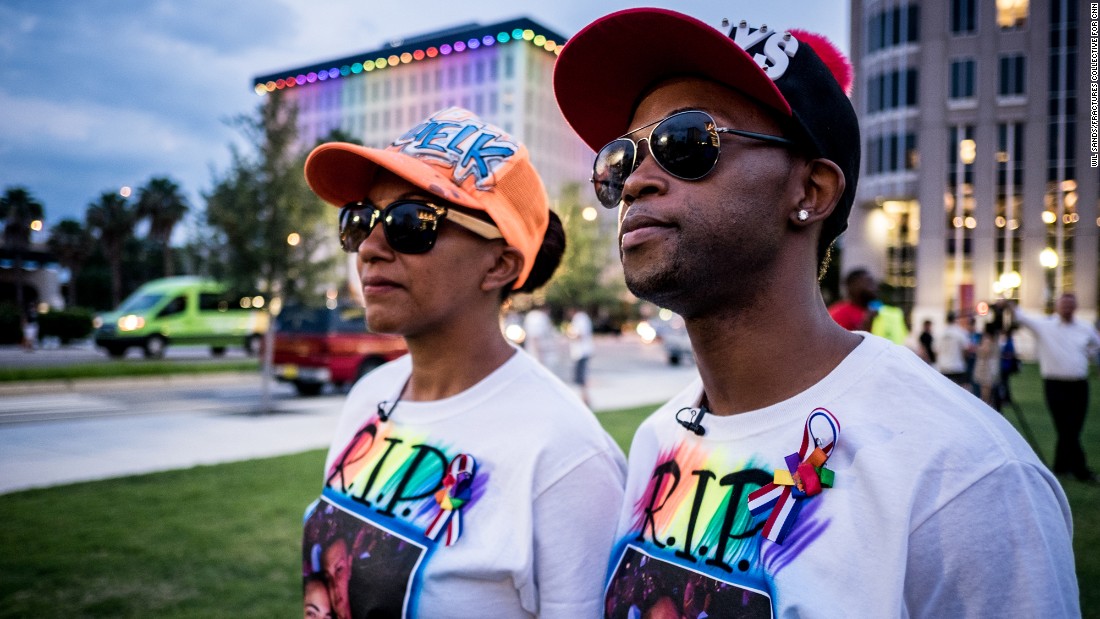 Family and friends of shooting victims Leroy Valentin Fernandez and Xavier Emmanuel Serrano Rosado attend the vigil. They were wearing matching &quot;RIP Eman &amp;amp; Roy&quot; shirts. &lt;a href=&quot;http://www.cnn.com/interactive/2016/06/us/orlando-attack-victims/&quot; target=&quot;_blank&quot;&gt;Learn more about the victims&lt;/a&gt;.