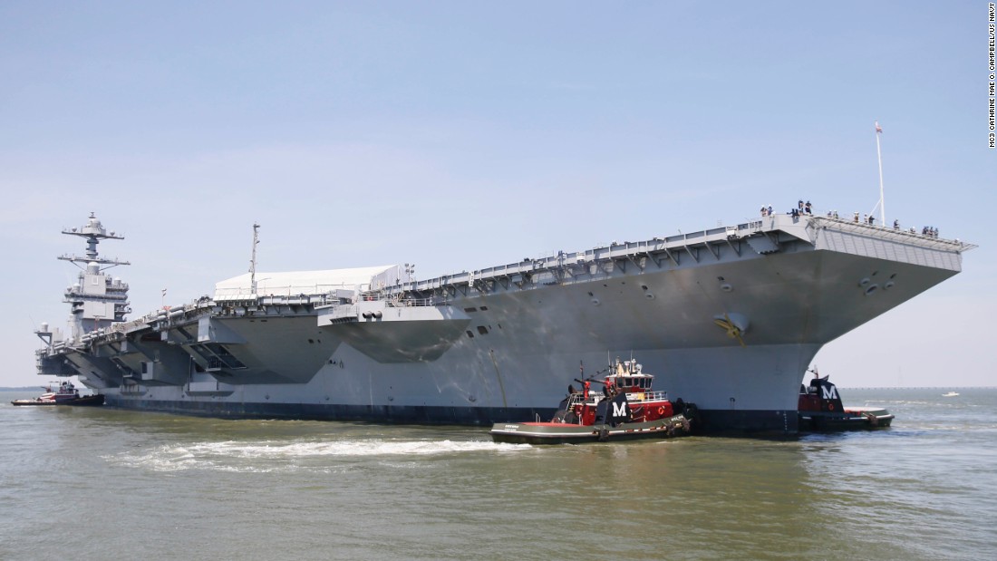 Tug boats maneuver the aircraft carrier Pre-Commissioning Unit Gerald R. Ford (CVN 78) into the James River during the ship&#39;s turn ship evolution on June 11, 2016. This is a major milestone that brings the country&#39;s newest aircraft carrier another step closer to delivery and commissioning later this year.