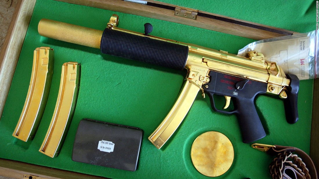 A gold-plated ceremonial MP5 submachine gun was displayed after its discovery near the Saddam Hussein&#39;s Republican Presidential Palace on April 14, 2003 in Bagdhad, Iraq. The weapon is designed to be stealthily fired while the briefcase is closed.