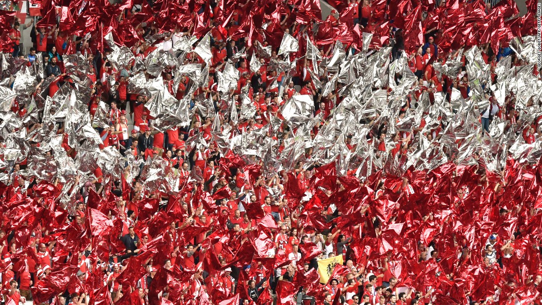 Austria fans wave their colors in the stadium before the match.