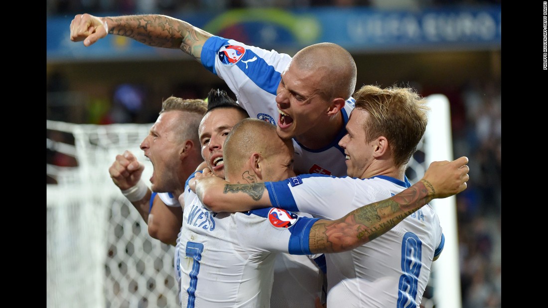 Slovakian players celebrate Hamsik&#39;s goal, which gave them a 2-0 lead just before halftime.