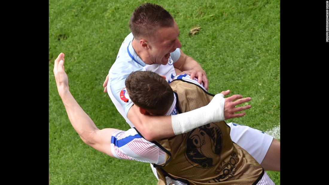 England substitute Jamie Vardy, top, embraces a teammate after tying the match in the 56th minute.