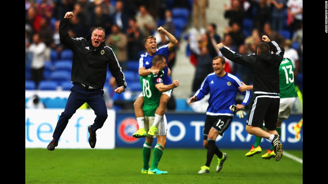 Northern Ireland manager Michael O&#39;Neill, left, celebrates a late goal during a 2-0 victory over Ukraine in Lyon, France.
