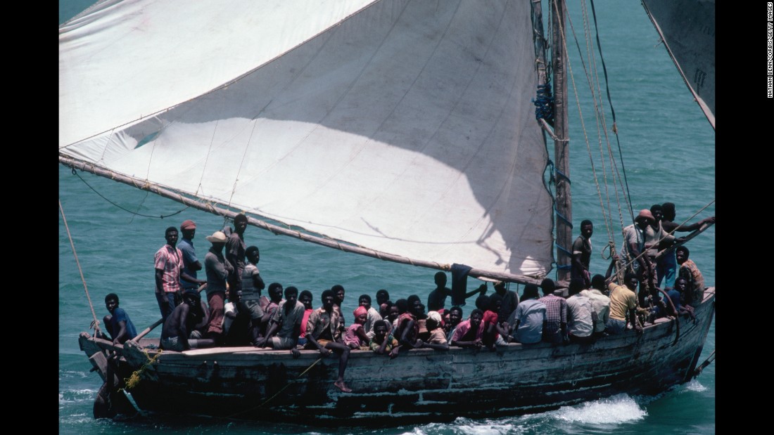 Large-scale Haitian migration to the United States began under the dictatorship of Jean-Claude &quot;Baby Doc&quot; Duvalier. They arrived in crowded boats, but unlike the Cubans they were refused asylum. Washington decided they were not political refugees but economic migrants.