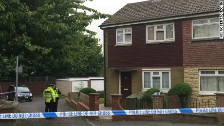 Police search a house near the scene of Jo Cox&#39;s killing in Birstall, England.