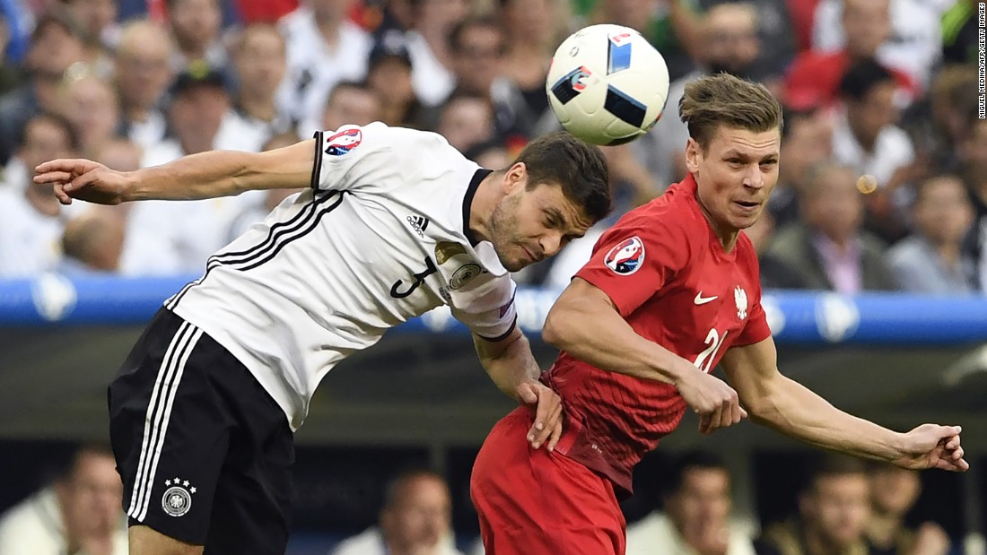 German defender Jonas Hector heads the ball near Poland&#39;s Lukasz Piszczek during a goalless draw at Euro 2016.