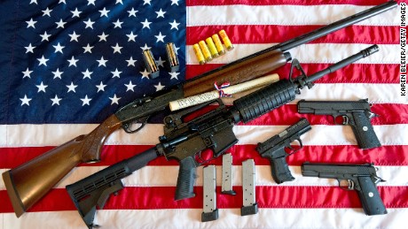 This February 4, 2013 photo illustration in Manassas, Virginia, shows a Remington 20-gauge semi-automatic shotgun, a Colt AR-15 semi-automatic rifle, a Colt .45 semi-auto handgun, a Walther PK380 semi-auto handgun and various ammunition clips with a copy of the US Constitution on top of the American flag. US President Barack Obama Monday heaped pressure on Congress for action &quot;soon&quot; on curbing gun violence. Obama made a pragmatic case for legislation on the contentious issue, arguing that just because political leaders could not save every life, they should at least try to save some victims of rampant gun crime. 