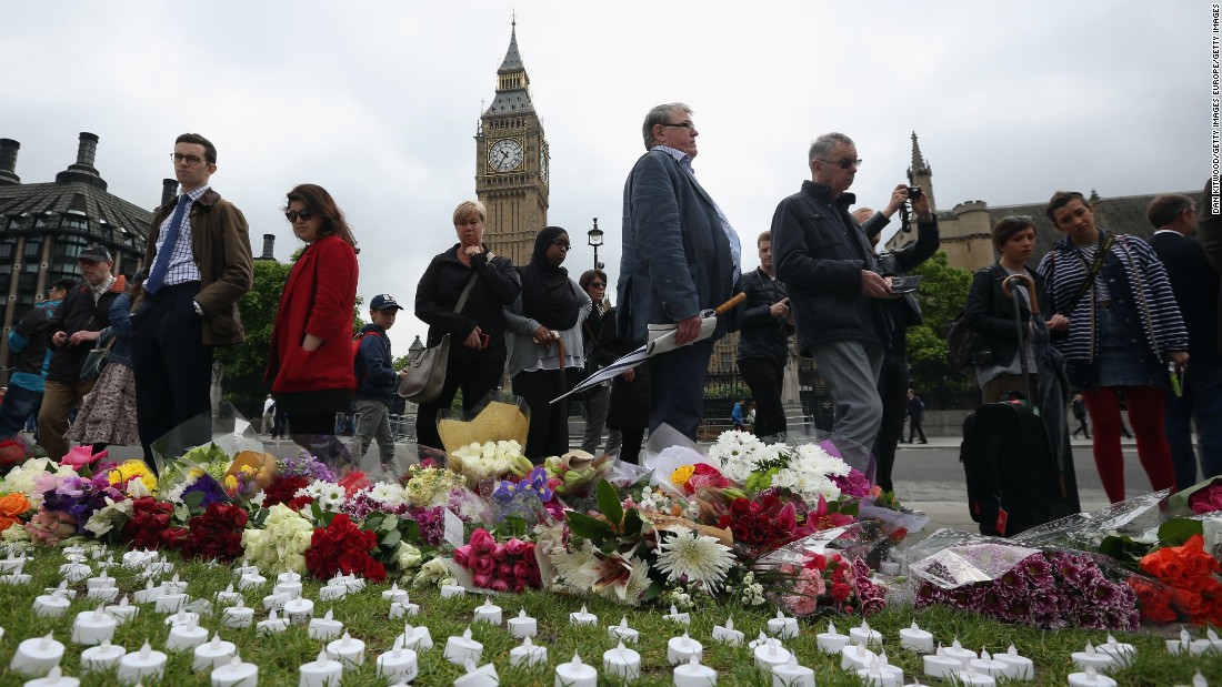People view tributes at Parliament Square in London on June 17.