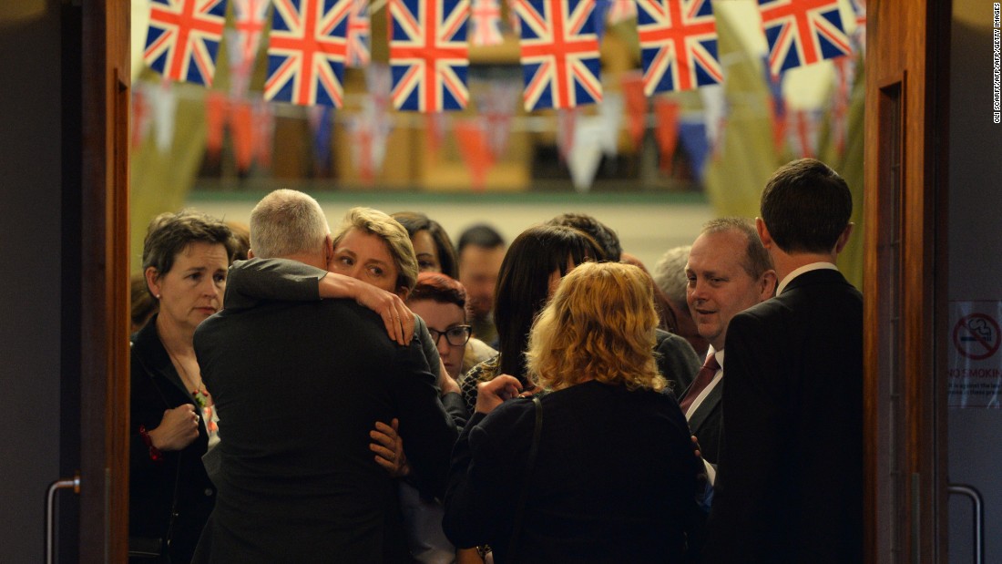 Parliament member Yvette Cooper, left, embraces Bishop Nick Baines after attending a Birstall vigil for Cox on Thursday, June 16.