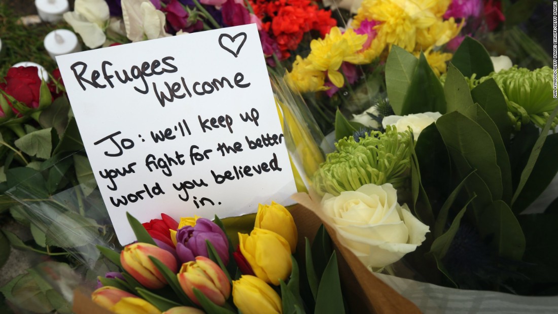 Flowers and personal messages are seen on Parliament Square on June 17. 
