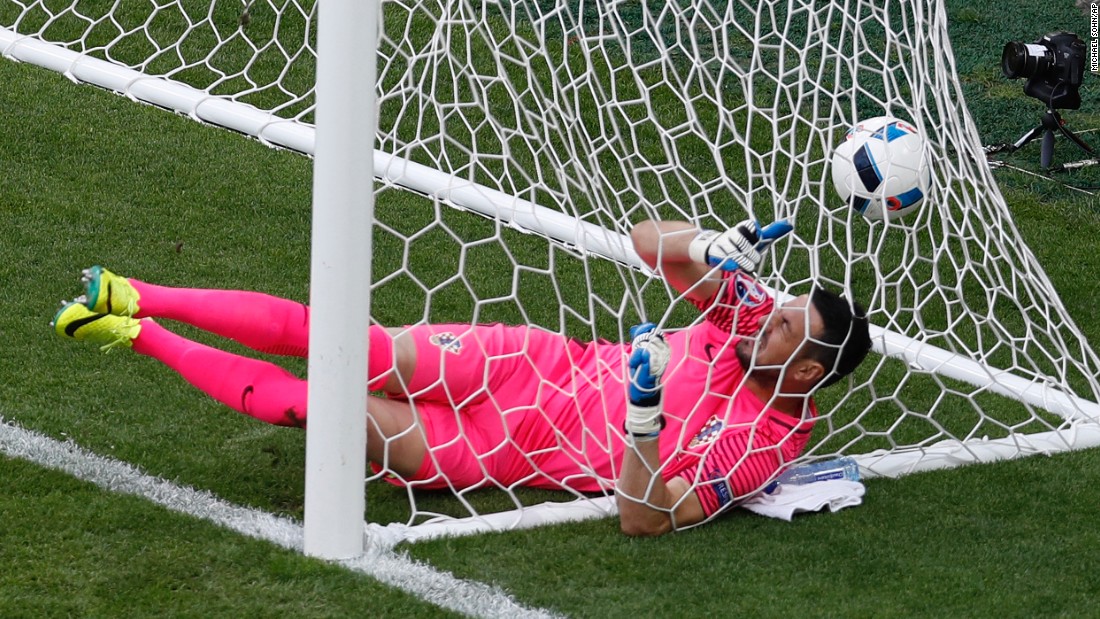Croatian goalkeeper Danijel Subasic falls into the net after Milan Skoda scored in the 75th minute.