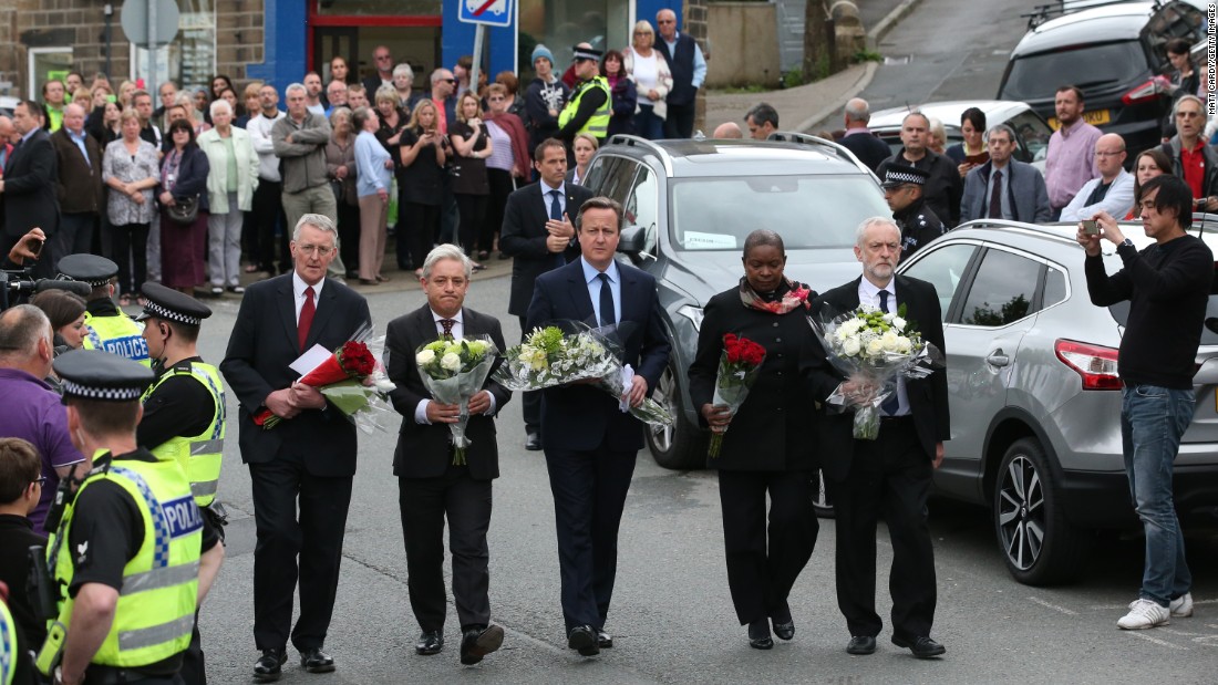 British Prime Minister David Cameron, center, joins other political leaders in paying their respects to slain Parliament member Jo Cox on Friday, June 17. Cox, 41, was stabbed and shot in Birstall, England, after a meeting with her constituents. A 52-year old man, Tommy Mair, is being held in police custody in connection with her death.