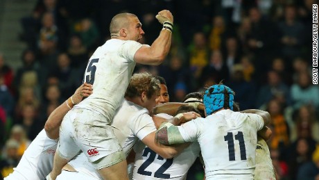Owen Farrell is congratulated by Mike Brown and his teammates after  scoring the winning try in the second Test against Australia. 
