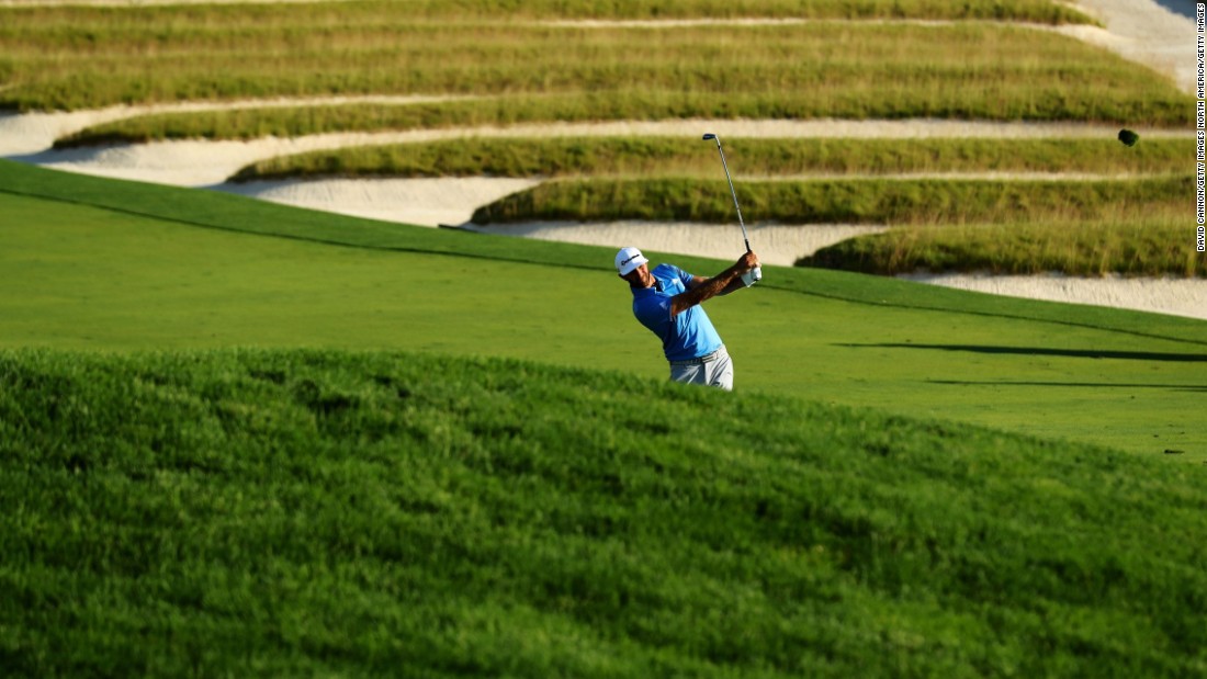 Dustin Johnson hits a shot on the third hole during the second round on Friday, June 17.