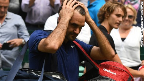 A dejected Roger Federer walks off after his semifinal defeat at Halle toAlexander Zverev of Germany. 