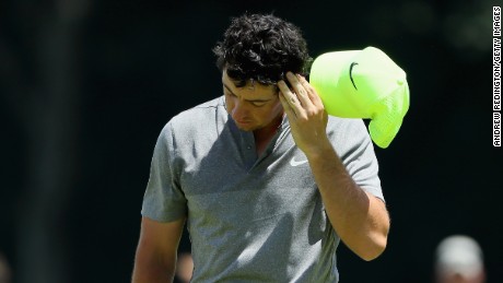 A deflated Rory McIlroy walks off his final hole of the second round at the U.S. Open having missed the cut. 