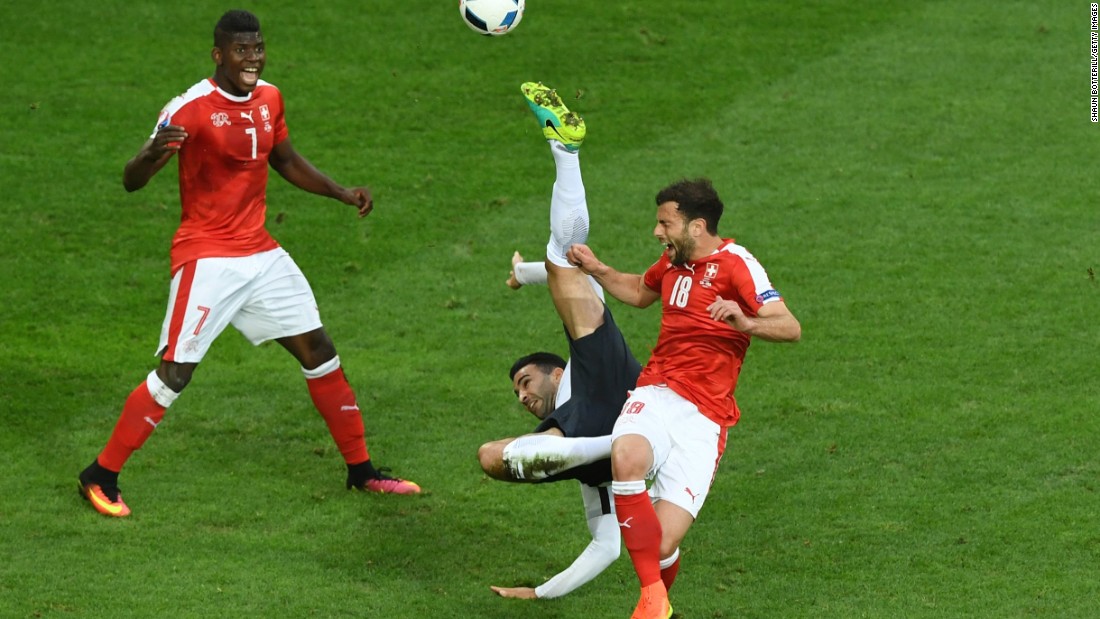  Adil Rami of France attempts an overhead kick while Admir Mehmedi of Switzerland tries to block during their match at Stade Pierre-Mauroy on Sunday in Lille, France. The game ended in a 0-0 draw. 