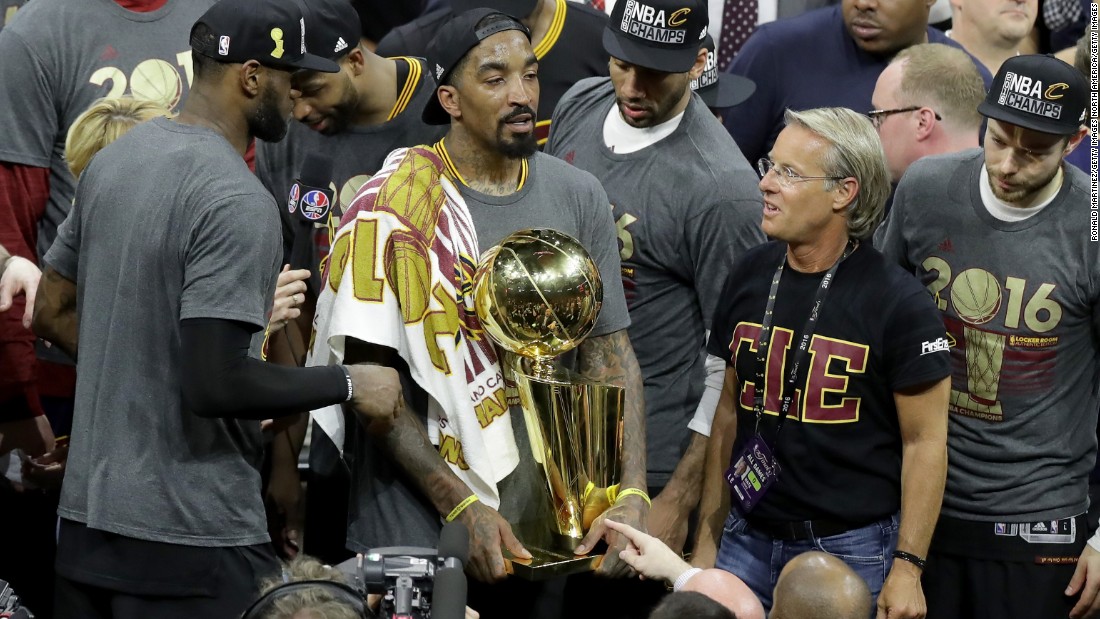 J.R. Smith (with trophy) of the Cleveland Cavaliers holds the Larry O&#39;Brien Championship Trophy. Smith broke down in tears during the post-game press conference when asked about his relationship with his father. The Cavaliers won the championship on Father&#39;s Day in the U.S. 