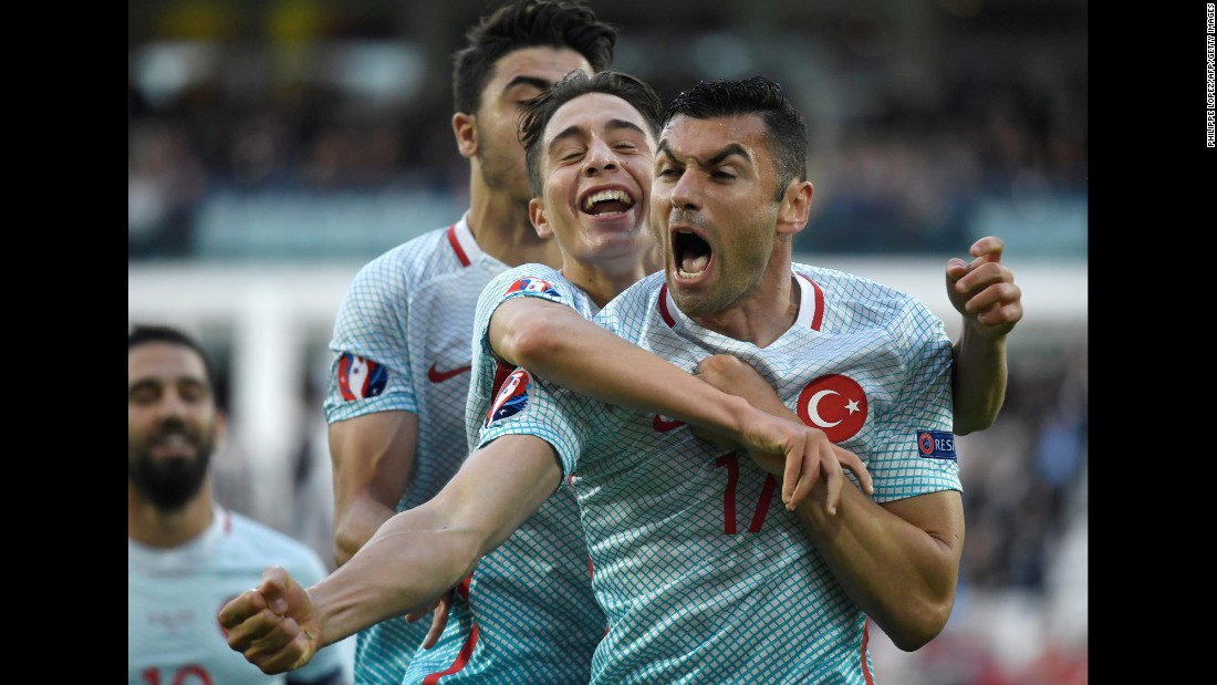 Turkish forward Burak Yilmaz, right, is congratulated by teammates after scoring the opening goal against the Czech Republic in Lens, France. Turkey won 2-0 and finished third in Group D. It could qualify for the knockout stage depending on other results in the tournament.