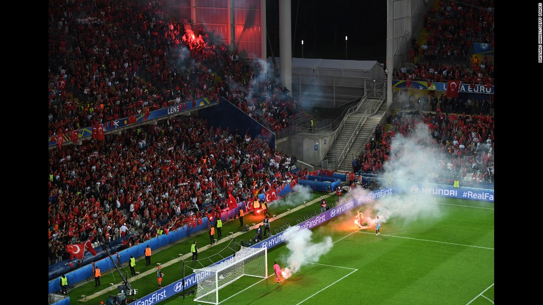 Flares were thrown on the field near Turkey&#39;s fans.