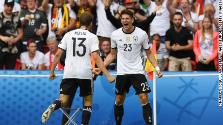 World champion Germany topped its group and faces Slovakia next.