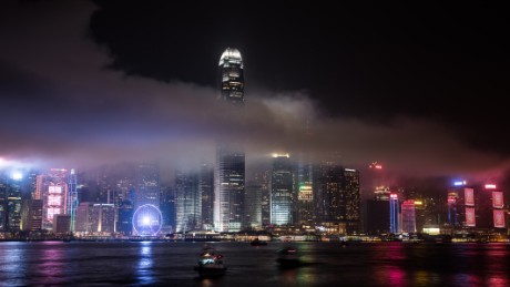 The IFC tower is seen shrouded in smoke after fireworks were fired over the city skyline as part of China&#39;s national day celebrations in Hong Kong on October 1, 2015. China is marking the 66th anniversary of the founding of the People&#39;s Republic of China on October 1, 1949.  AFP PHOTO / Philippe Lopez        (Photo credit should read PHILIPPE LOPEZ/AFP/Getty Images)