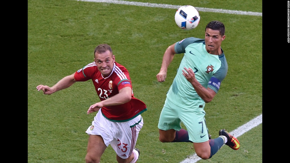 Portugal star Cristiano Ronaldo, right, heads in his second goal of the match. Portugal finished third in Group F and will play Croatia in the round of 16.