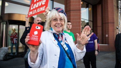 LONDON, ENGLAND - JUNE 24:  A vote LEAVE supporter Christine Forrester celebrates with others outside Vote Leave HQ, Westminster Tower on June 24, 2016 in London, England. The United Kingdom has gone to the polls to decide whether or not the country wishes to remain within the European Union. After a hard fought campaign from both REMAIN and LEAVE the vote is awaiting a final declaration and the United Kingdom is projected to have voted to LEAVE the European Union.   (Photo by Chris J Ratcliffe/Getty Images)