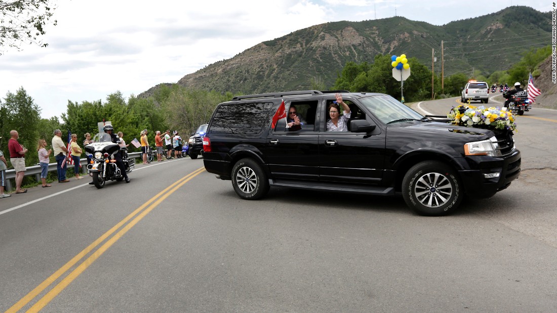 Family members of U.S. Marine Capt. Jeff Kuss thank people on the way to his funeral in Durango, Colorado, on Saturday, June 11. Kuss, a pilot with the Blue Angels demonstration team, &lt;a href=&quot;http://www.cnn.com/2016/06/03/politics/blue-angels-pilot-identified/&quot; target=&quot;_blank&quot;&gt;died when his plane crashed during practice&lt;/a&gt; in Tennessee. He was 32.
